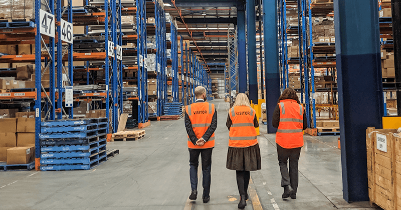 three people in warehouse for lease in Sydney